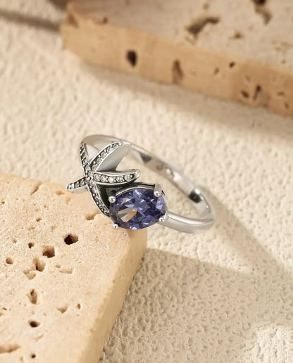 Sjöstjärna Ring - oval violett zirkonia 5 x 7 mm med pavésatt stjärna, storlek 5 till 9, 925 sterlingsilver