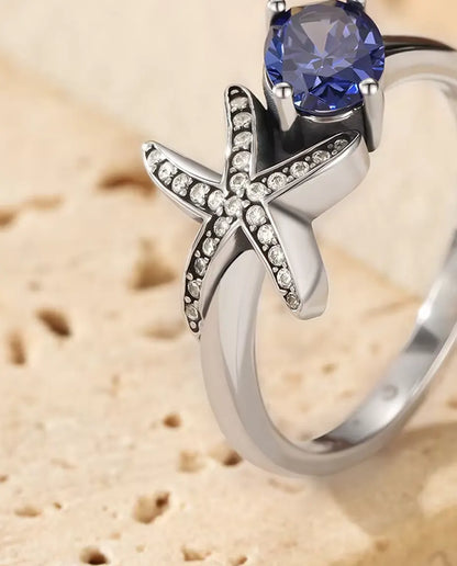Sjöstjärna Ring - oval violett zirkonia 5 x 7 mm med pavésatt stjärna, storlek 5 till 9, 925 sterlingsilver