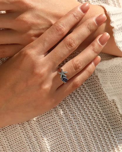Sjöstjärna Ring - oval violett zirkonia 5 x 7 mm med pavésatt stjärna, storlek 5 till 9, 925 sterlingsilver